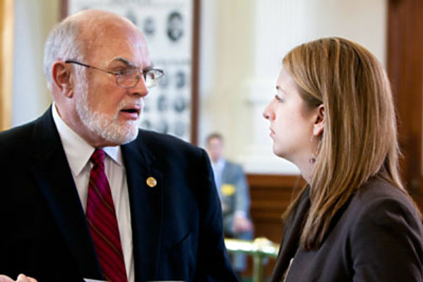 State Sen. Robert Nichols speaks with a staff member in this file photo. (Courtesy Photo)