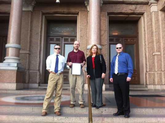 Malakoff resident Clint Stutts (far right) stands in the Texas Capitol Tuesday, Jan. 8, before the 83rd Legislative Session convened. He is joined by friends from Ellis and Tarrant counties, most of whom are involved with a bill Stutts helped write to nullify the Patient Protection and Affordable Care Act, better known as Obamacare. (COURTESY PHOTO)
