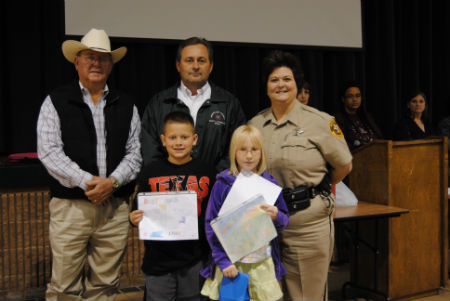 CROSS ROADS ELEMENTARY: Pictured are winners from Cross Roads with Sheriff Ray Nutt, Clint Davis, County Attorney, and Deputy Jannell Dunnington, HCSO.