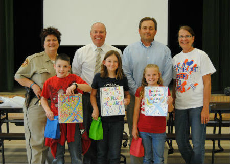 MURCHISON ELEMENTARY: Pictured are winners from Murchison Elementary with Deputy Jannell Dunnington, HCSO, Scott McKee, District Attorney, Clint Davis, County Attorney, and Mrs. Schmidt, 4th grade teacher.