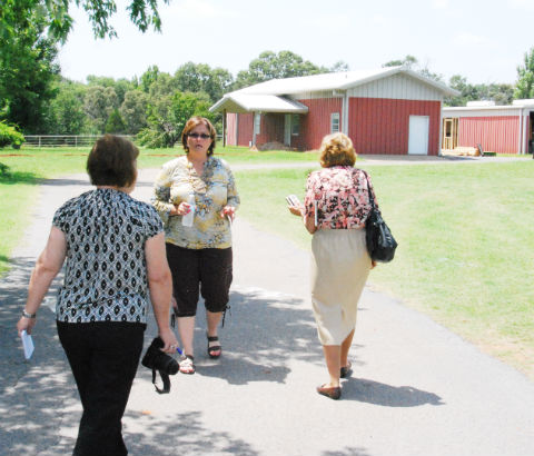 ACPA Headmistress Theresa DeMay (facing camera) gives a tour of the school's new campus to Athens Review reporter Kathi Nailling (left) and Tyler Morning Telegraph reporter Betty Waters.