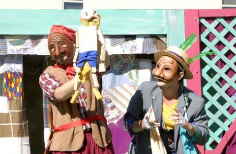 Pantalone (Geppetto, played by Devon Martin) marvels at his wooden creation as Arlecchino (Cricket, played by Jameson Lange) looks on during a rehearsal Tuesday for Trinity Valley Community College’s upcoming performance, “Pinocchio Commedia.” Area schoolchildren will be treated to the outdoor show several times this week and a public performance will be held Friday at 6:30 p.m. at McDonald Plaza on TVCC’s Athens campus.