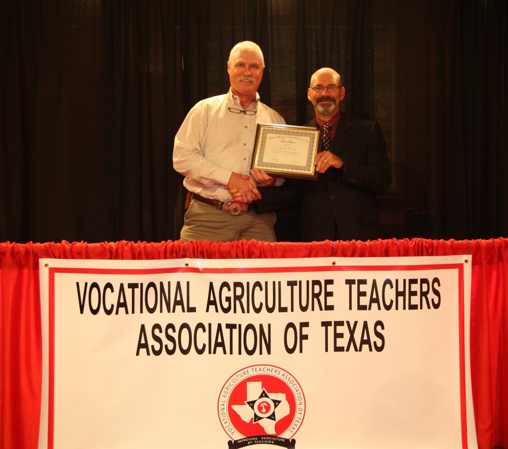 Malakoff Ag teacher Ken Hancock, left, receives his 20-year Tenure Award.