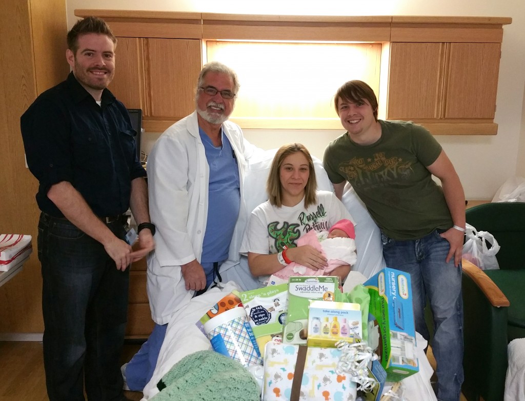 Pictured are, from left, Dr. Michael Swartwood, Dr. Gregory Mondini, Patricia Stinson holding Graci Mae, and Russell Stinson.