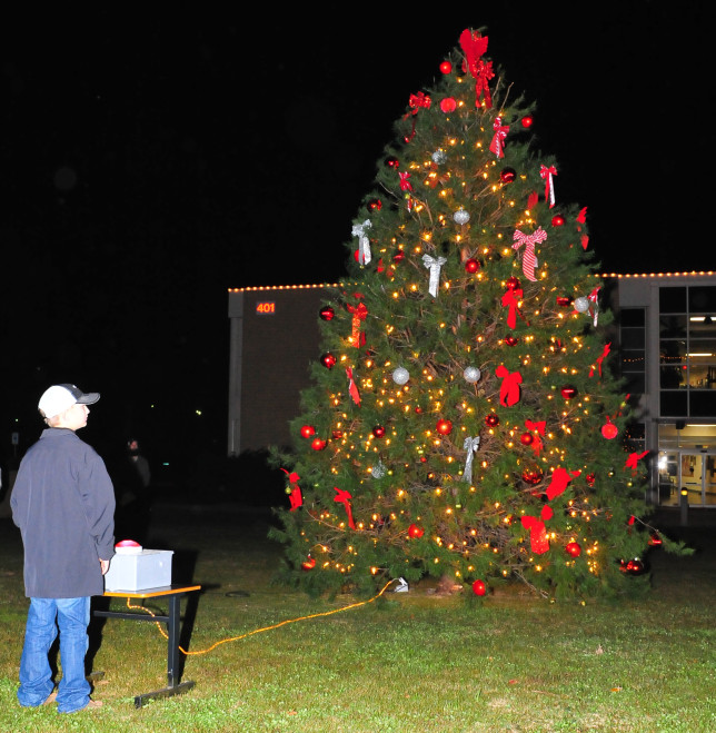 Colton Robertson, winner of the Cardinal Christmas coloring contest, lights the TVCC tree. (Courtesy photo)