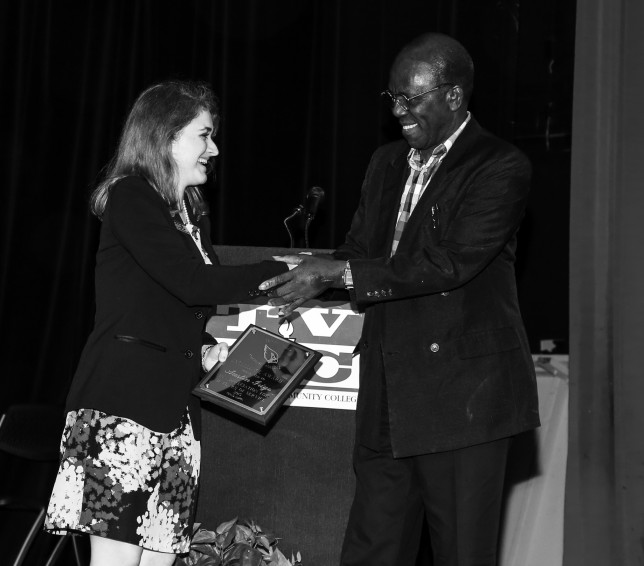 TVCC Adult Education Transition Coordinator Natalie Brown presents the first-ever Excellence Award to instructor Austin Irigo. (Courtesy photo)