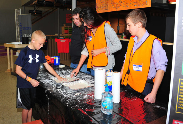Steven Wingfield discovers “oobleck,” a non-Newtonian fluid mixture as explained by TVCC Professor Dr. Michael Felty and Science Club students Nazik Orazgeldiyeva and Niyaz Murtazin. (Courtesy photo)