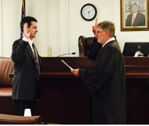 Dan Hunt being sworn in by 173rd District Judge Dan Moore. (Courtesy photo)